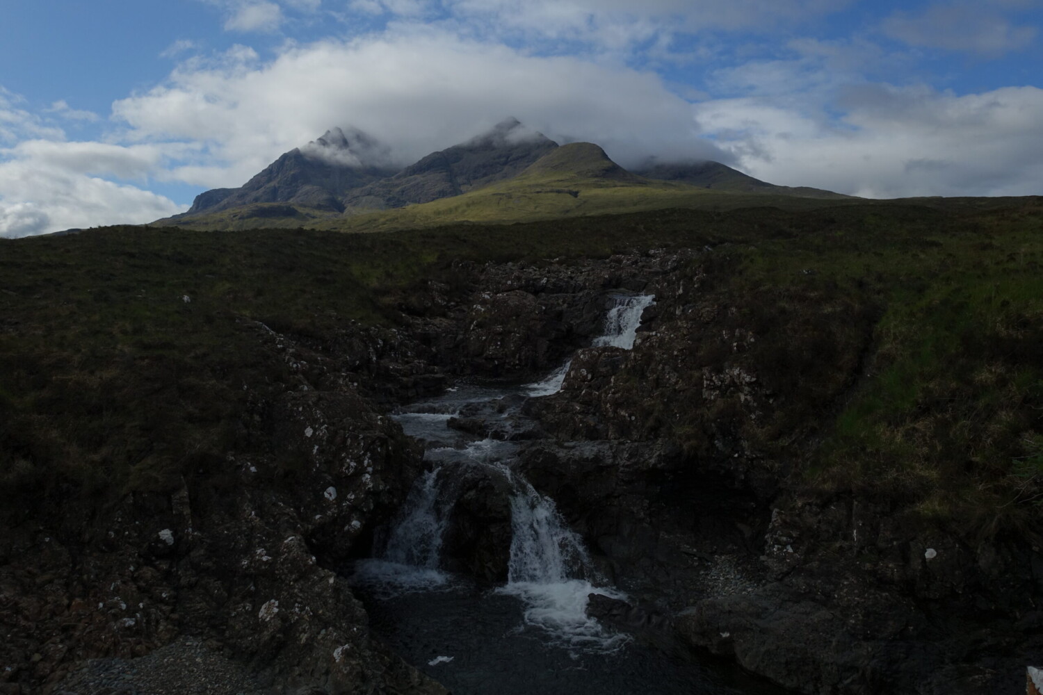 Oppressive weather gathering on the Cuillin Cuillin Ridge, covered by cloud. Viewd from Sligachan