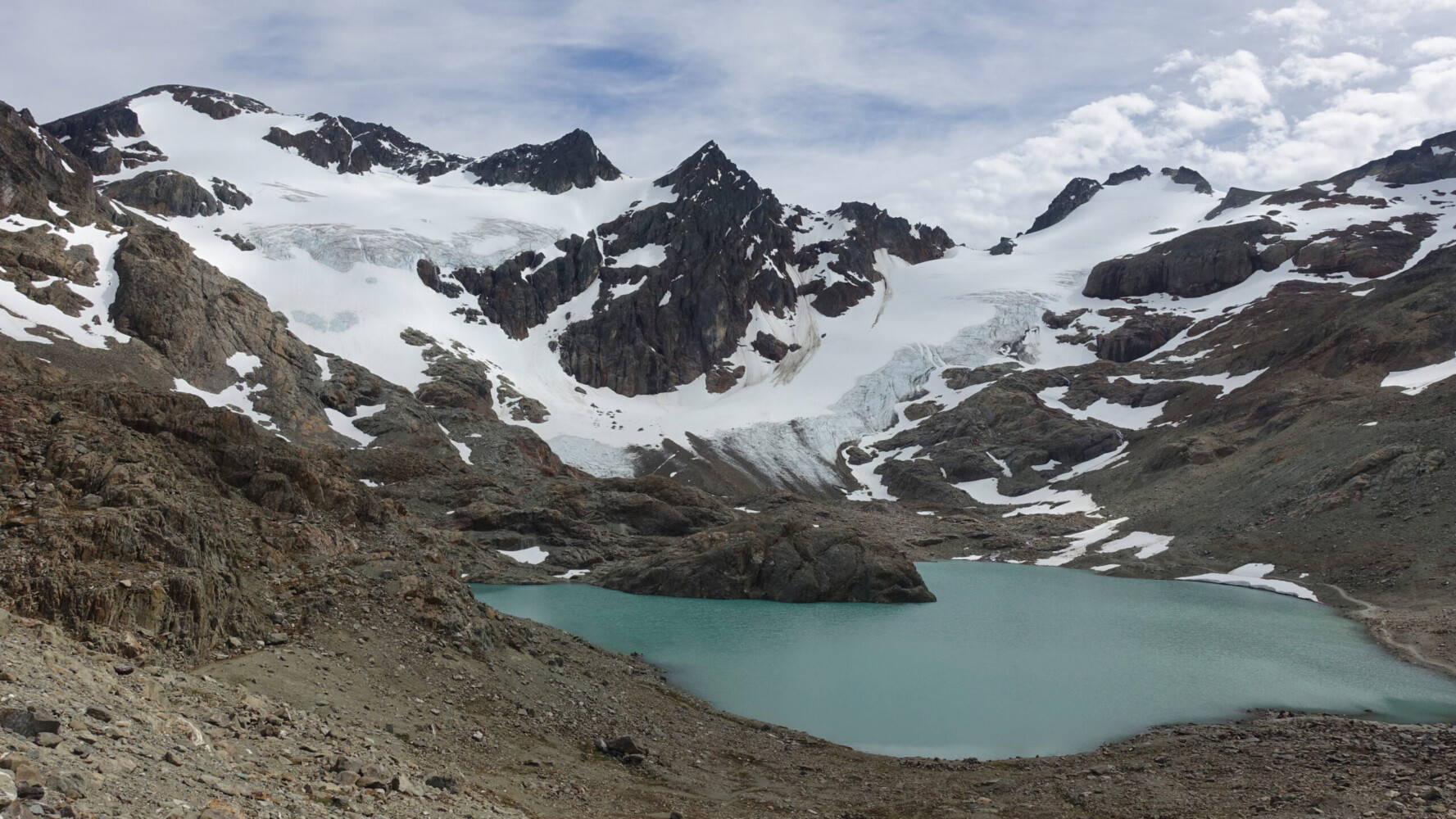 Glaciar Vinciguerro a lake surrounded by mountains in Tierra del Fuego