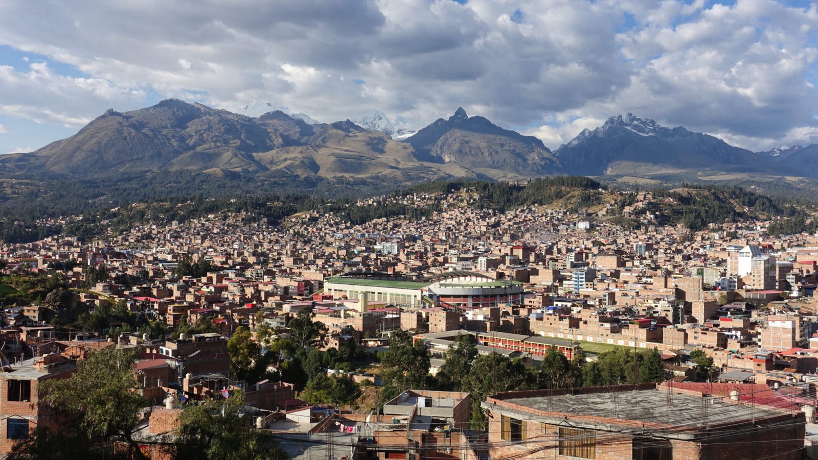 Above Huaraz, looking toward southern Cordillera Blanca. I think the sharp, rocky peak in the centre-foreground is Rima Rima, with Nevado Churup to the left and to the right is Vallunareju Norte, and maybe Tocllaraju. Huaraz panorama with Cordillera Blanca in background